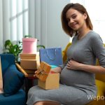pregnant woman opens gifts