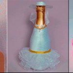 bottle of champagne in a dress made of ribbons