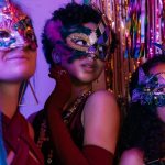 Girls in New Year&#39;s costumes and masks