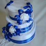 Treasury for money in the form of a birthday cake, decorated with blue ribbons