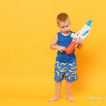 4 year old boy with a water pistol